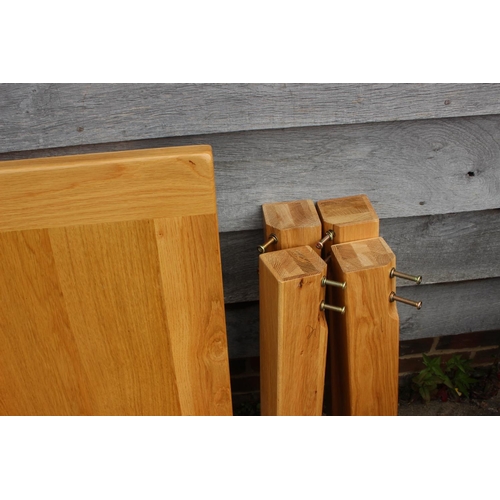 639 - An oak square top dining table, on stile supports, 35