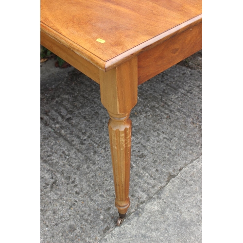 641 - A mahogany extending dining table with three leaves, on reeded supports, 39