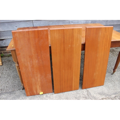 641 - A mahogany extending dining table with three leaves, on reeded supports, 39