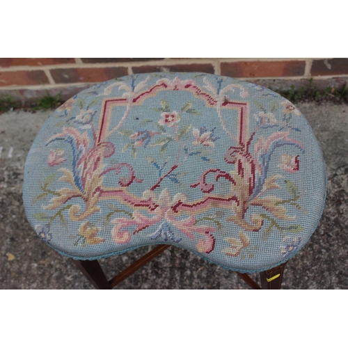 657 - An Edwardian mahogany and inlaid kidney-shaped stool with needlepoint seat, on square taper supports