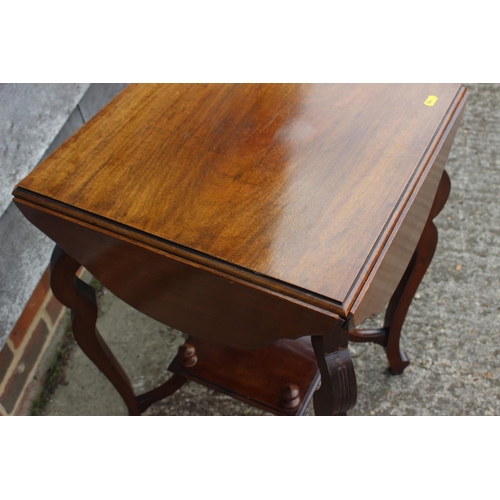 658 - An Edwardian walnut quadruple drop leaf occasional two-tier table, on shaped supports, 18