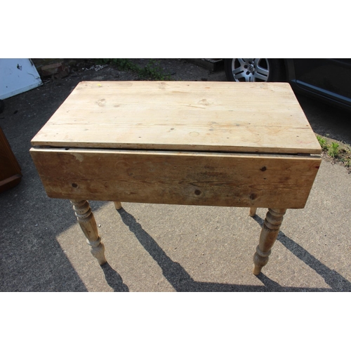 683 - A waxed pine single drop leaf table with scrubbed top, 36