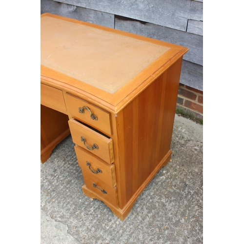 684 - A waxed pine double pedestal desk with tooled leather lined top, fitted nine drawers, 37