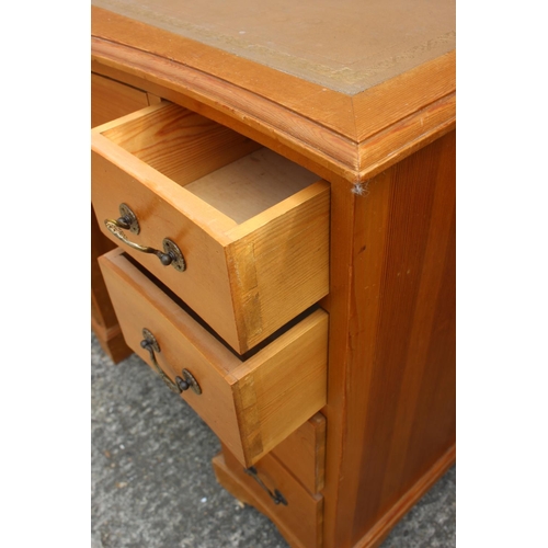 684 - A waxed pine double pedestal desk with tooled leather lined top, fitted nine drawers, 37