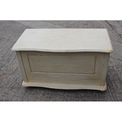 697 - A crackle painted serpentine front blanket box with fall front and lift-up lid, 37