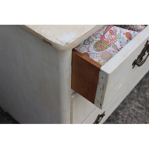 698 - A white painted chest of three long drawers with brass handles, 37 1/2