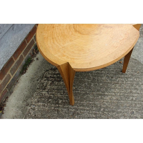 661 - Rufus Wixon: a light oak oval shape top table, on tapering supports, dated 30-4-1994, 36