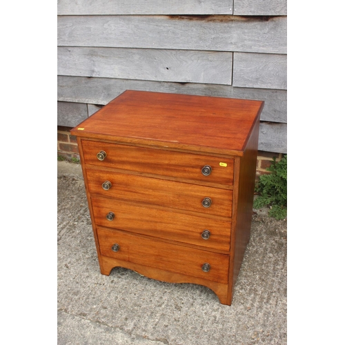 699 - A pine chest of four long drawers with brass knob handles, 25