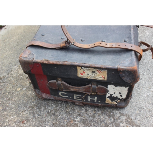 710 - A canvas and leather bound trunk, 36