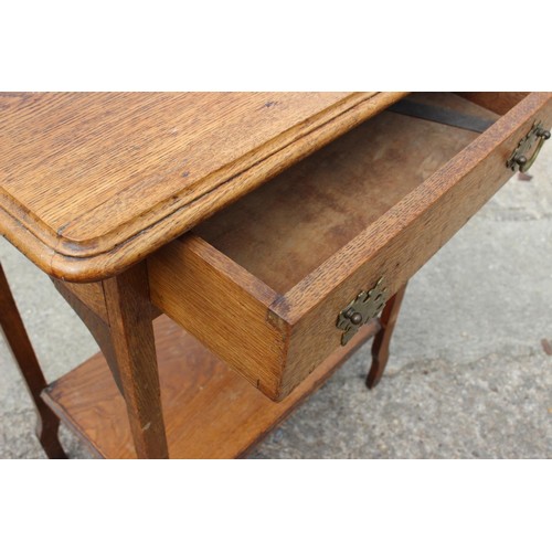 645 - An oak and embossed copper log bin, 17 1/2