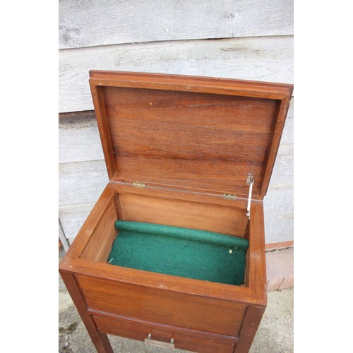 628 - A 1940s oak sewing box with silk lined interior, on slender supports, 13