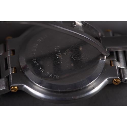 409 - A gentleman's stainless steel and gilt metal bracelet watch with black dial, baton numerals and date... 