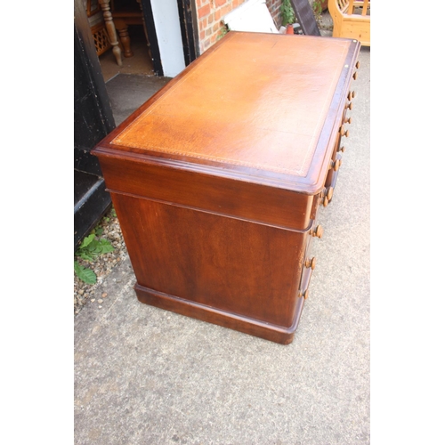 512 - A late 19th century mahogany double pedestal desk with tool lined top, nine drawers with knob handle... 