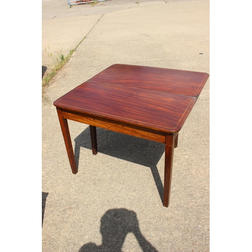 516 - A 19th century mahogany box and ebony line inlaid fold-over top tea table, on square taper supports,... 