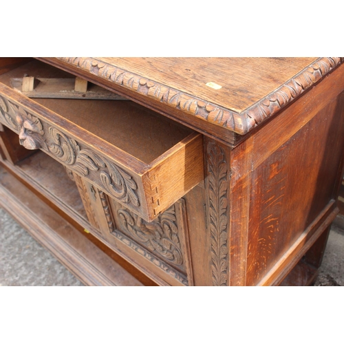 546 - A carved oak sideboard of 17th century design, fitted two long drawers, over central small drawer an... 