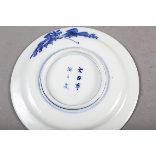 55 - A Chinese blue and white shaped edge plate with floral decoration, 10 1/2