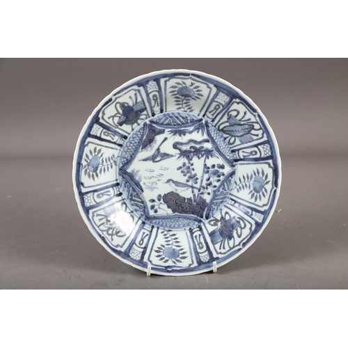 55 - A Chinese blue and white shaped edge plate with floral decoration, 10 1/2