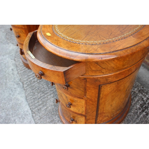 556 - A late 19th century figured walnut kidney-shaped double pedestal desk with tooled leather lined top,... 