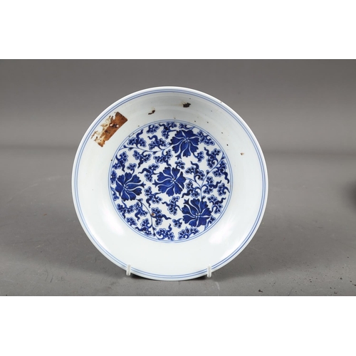 56 - A Chinese blue and white dish with floral and scrolled decoration with seal mark to base, 7 1/2