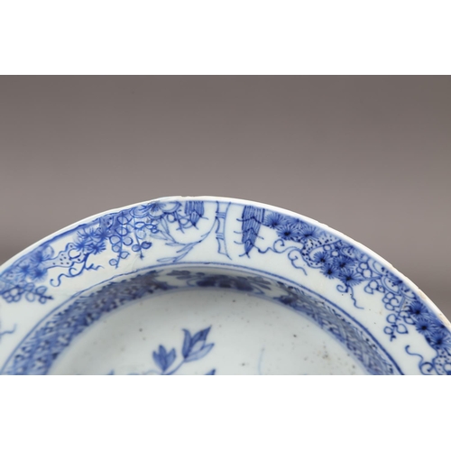 56 - A Chinese blue and white dish with floral and scrolled decoration with seal mark to base, 7 1/2