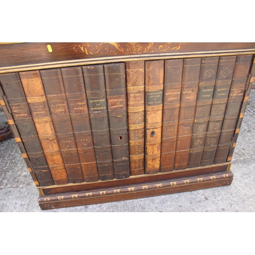 561 - A 19th century grained as rosewood brass gallery top cupboard enclosed faux book spine doors, 44