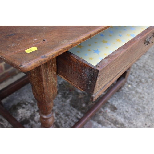 563 - A late 18th century oak centre table, fitted one drawer, on bobbin turned and stretchered supports, ... 