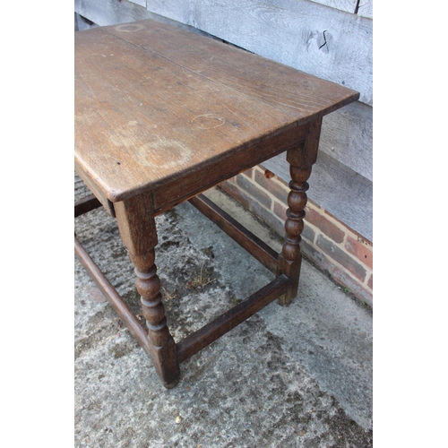 563 - A late 18th century oak centre table, fitted one drawer, on bobbin turned and stretchered supports, ... 