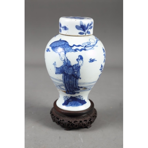 57 - A Chinese blue and white vase with matched lid, with figure and urn decoration, 6 1/4