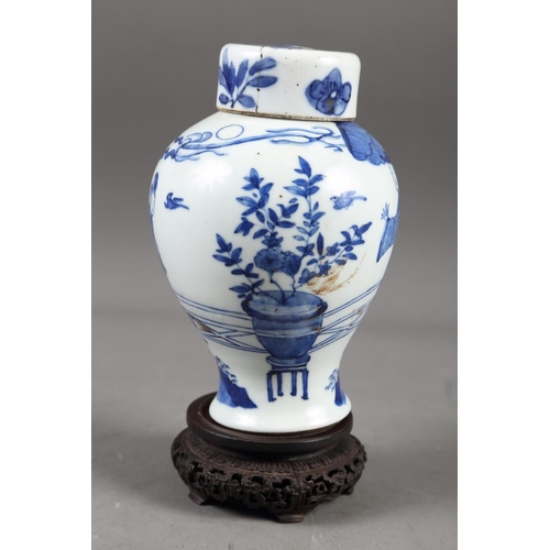 57 - A Chinese blue and white vase with matched lid, with figure and urn decoration, 6 1/4