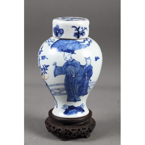 57 - A Chinese blue and white vase with matched lid, with figure and urn decoration, 6 1/4