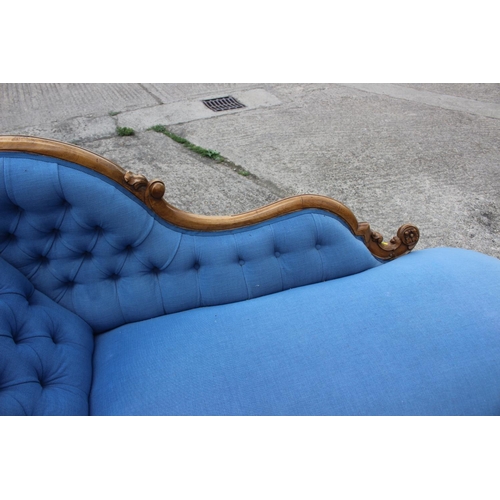 573 - A late 19th century shape-back chaise longue, button upholstered in a blue fabric, on cabriole casto... 