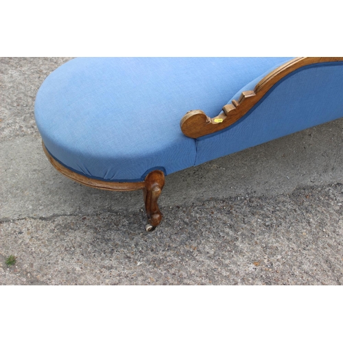 573 - A late 19th century shape-back chaise longue, button upholstered in a blue fabric, on cabriole casto... 