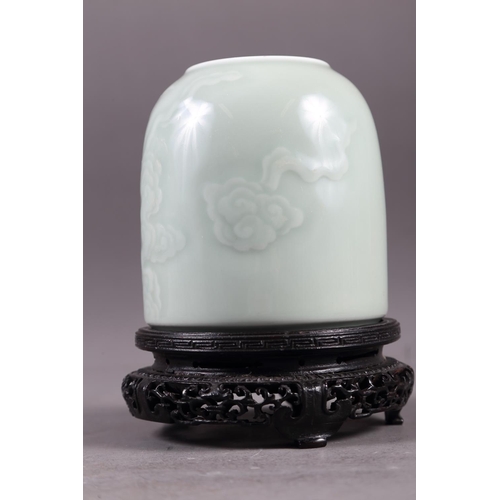 58 - A Chinese celadon glazed brush washer with cloud decoration and six-character mark to base, 4 3/4