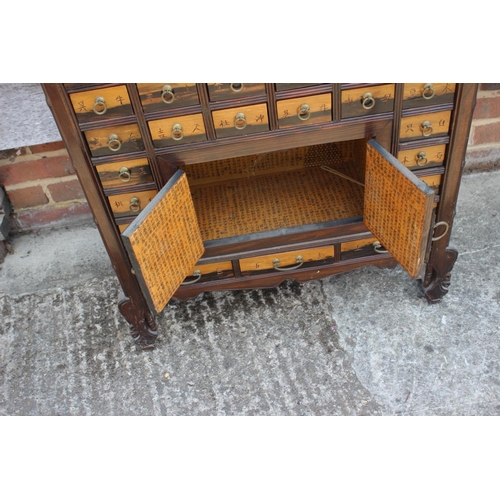 587 - A Korean medicine cabinet, fitted numerous drawers and cupboards, 30