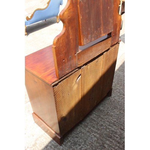 624 - An Edwardian walnut dressing chest, fitted mirror over jewel drawer and three graduated long drawers... 