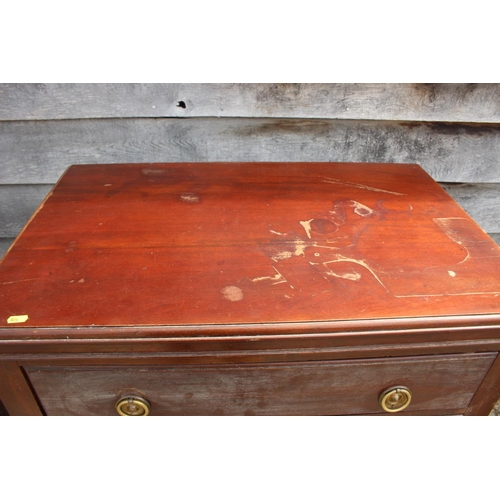 635 - A walnut chest of three long drawers with ring handles, on cabriole supports, 32