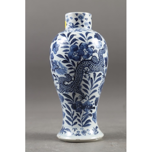 64 - A Chinese blue and white baluster vase with dragon and flower decoration, four-character mark to bas... 