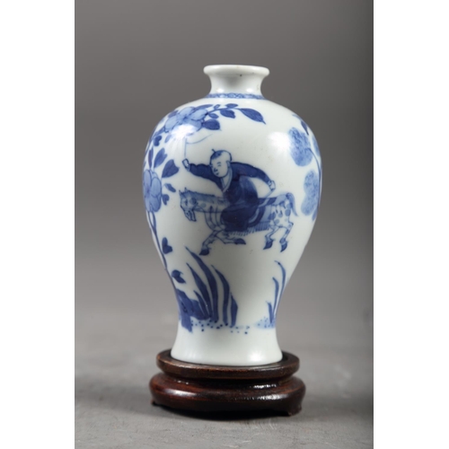 65 - A Chinese blue and white meiping vase with figure on horseback in a landscape decoration, 4 1/4