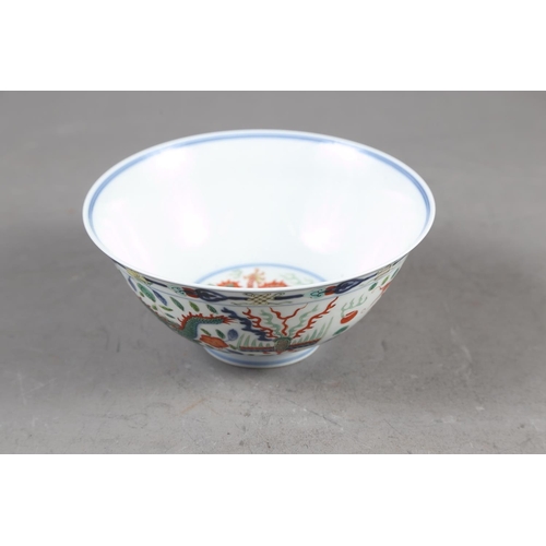 66 - A Chinese famille verte bowl with two dragon and phoenix decoration, seal mark to base, 6 1/4