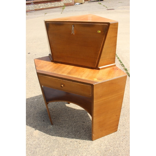 667 - A 1950s teak corner fall front bureau with fitted interior over one drawer and kneehole, 38