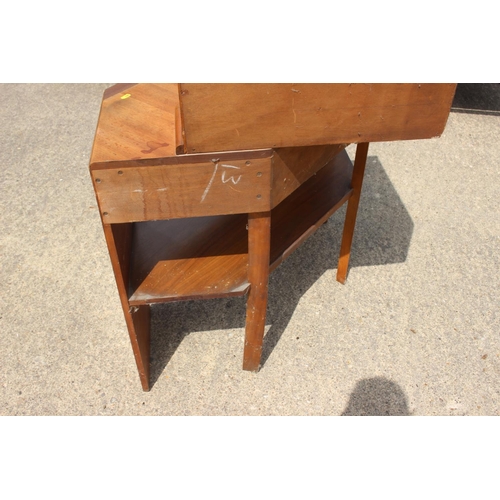 667 - A 1950s teak corner fall front bureau with fitted interior over one drawer and kneehole, 38