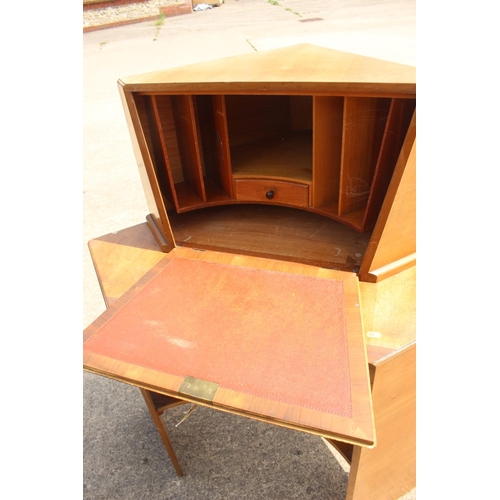 667 - A 1950s teak corner fall front bureau with fitted interior over one drawer and kneehole, 38