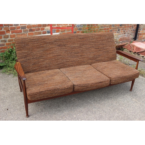 669 - A 1960s teak showframe three-seat settee and a pair of matching adjustable armchairs, together with ... 