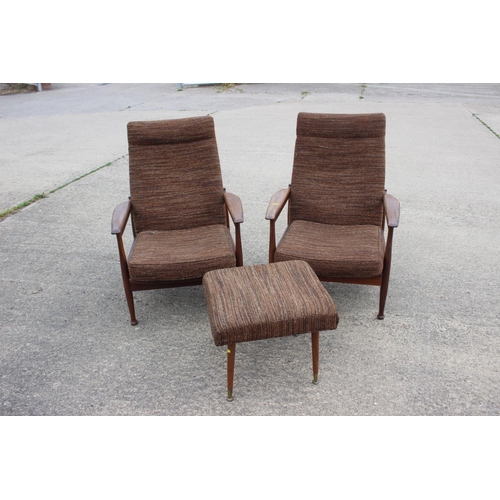 669 - A 1960s teak showframe three-seat settee and a pair of matching adjustable armchairs, together with ... 