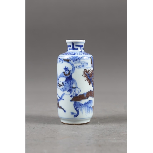 67 - A Chinese blue, white and iron oxide glazed cylindrical miniature vase with warriors in a landscape ... 