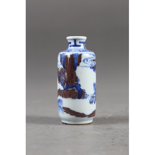 67 - A Chinese blue, white and iron oxide glazed cylindrical miniature vase with warriors in a landscape ... 