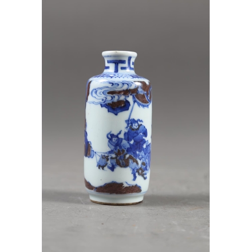 67 - A Chinese blue, white and iron oxide glazed cylindrical miniature vase with warriors in a landscape ... 