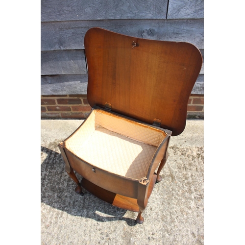 674 - A walnut veneered sewing table, on cabriole supports, and a painted dressing table stool with drop-i... 