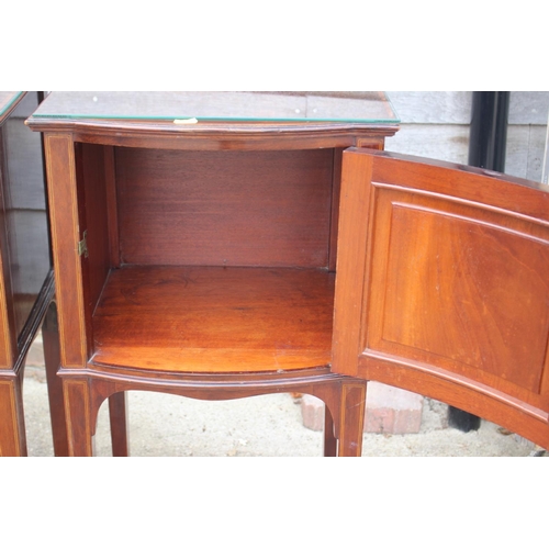 678 - A pair of Edwardian mahogany and kingwood banded bowfront bedside cupboards, on square taper support... 