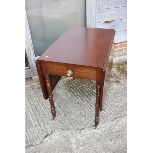 679 - An Edwardian mahogany Pembroke table, fitted one drawer, on turned and castored supports, 32 1/2